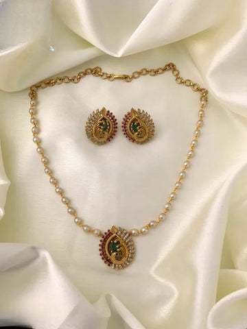 White Pearl Mala with Elegant Red Stone Peacock Pendant With Matching Earrings Set Rofarword