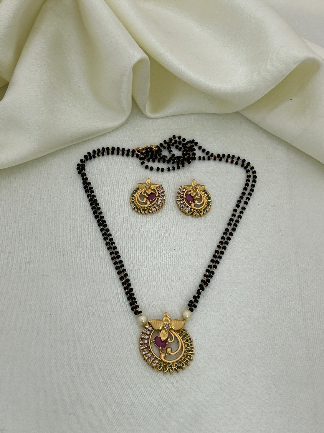Elegant Gold Mangal sutra Pendant with Ruby and Emerald Accents